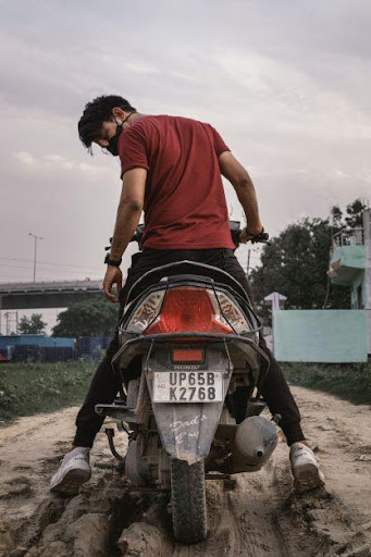 person on motorbike stuck in mud