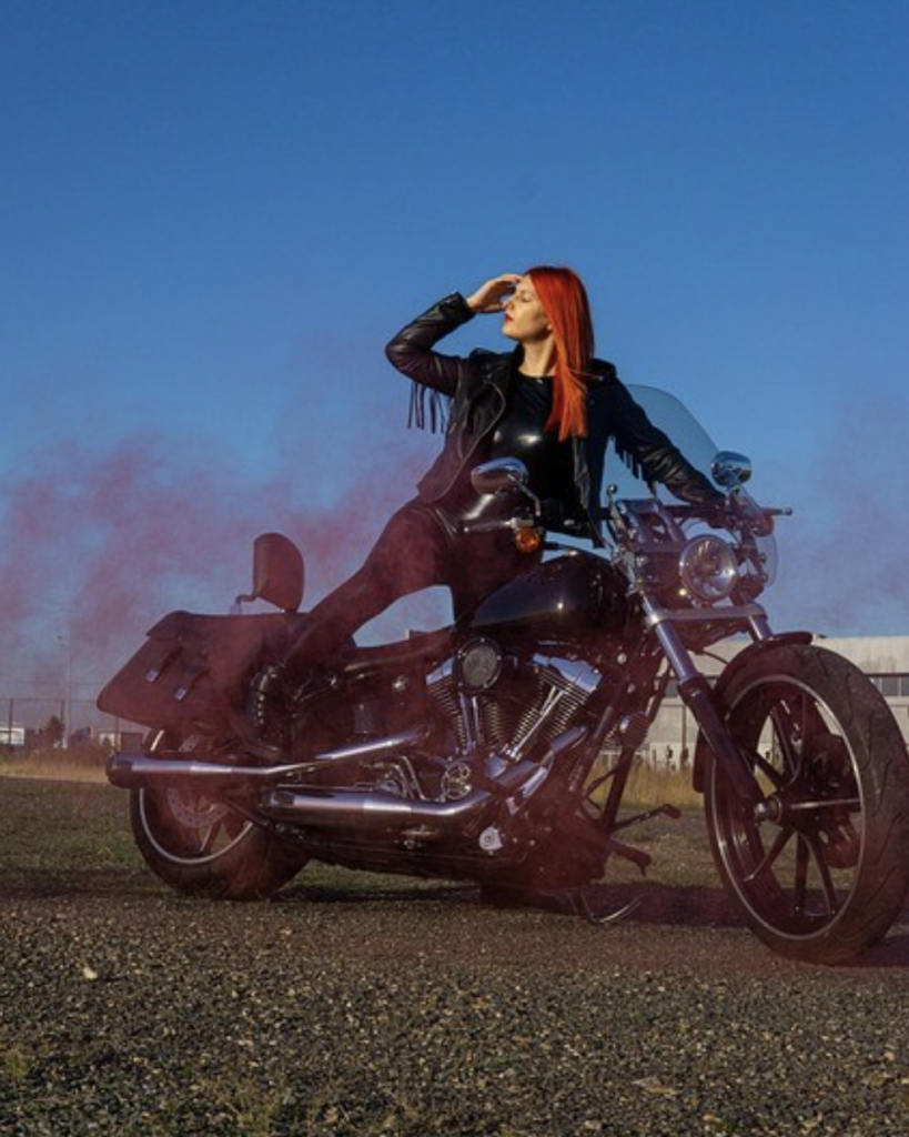 woman with red hair on motorcycle